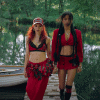 Nova Twins - Photo Credit - Fin Frew - Two women in red outfits standing on a dock