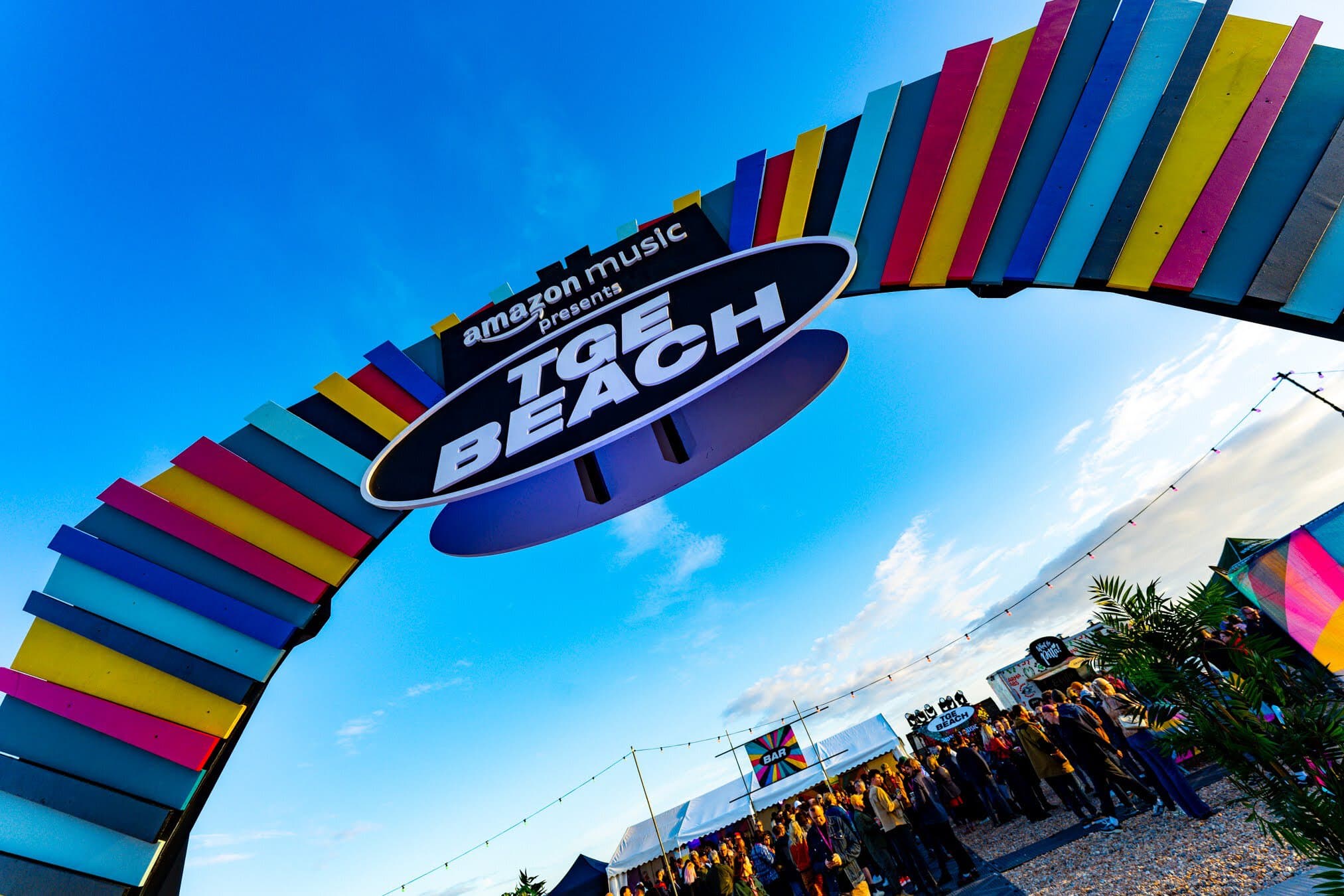 The colourful TGE Beach arch on Brighton seafront at The Great Escape opening party, May 2023